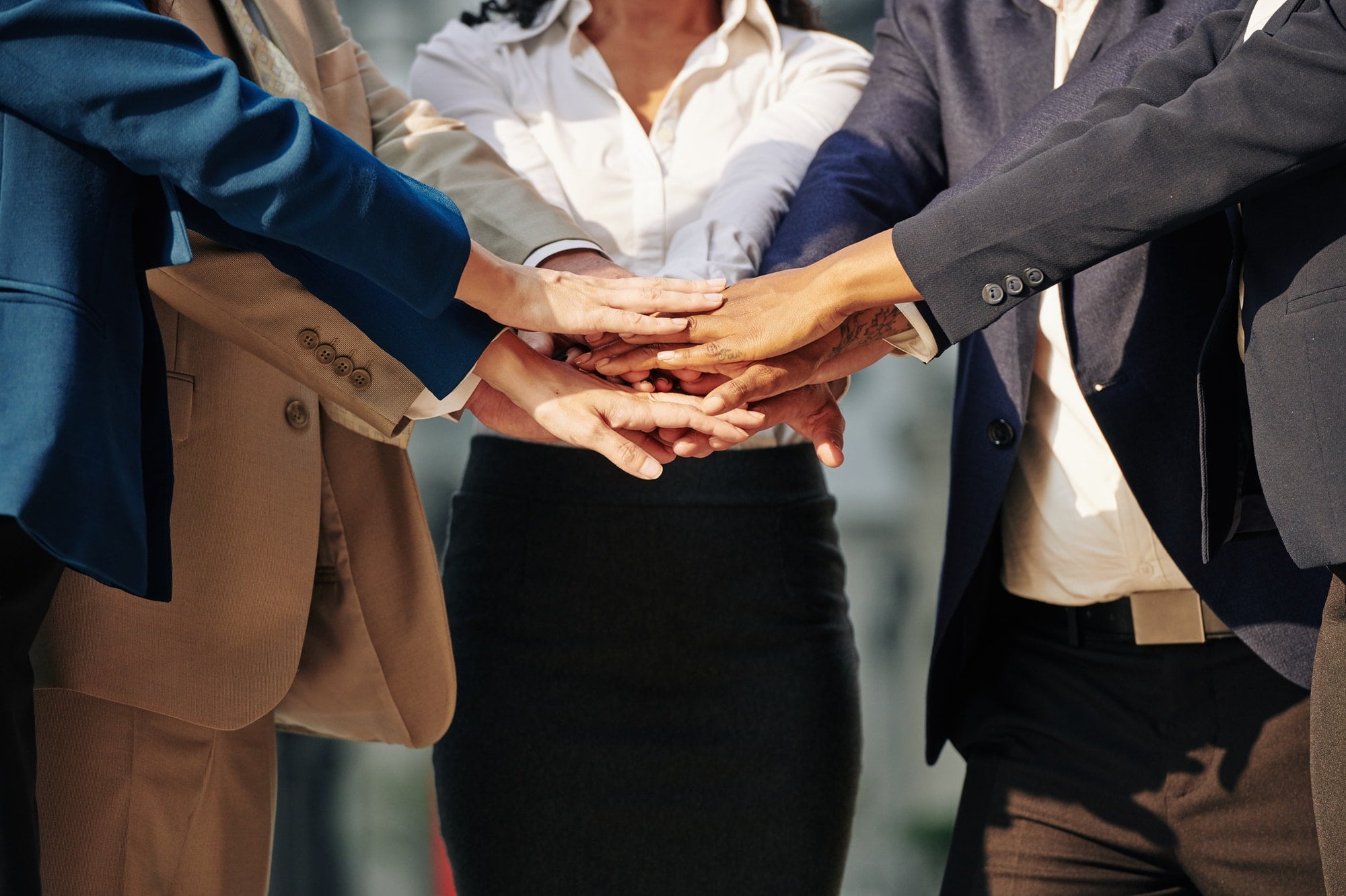 Business team stacking hands